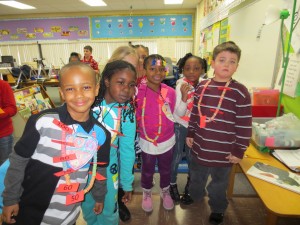 Randels Elementary Students Make Fruit Loop Necklaces to Celebrate the 100th Day of School